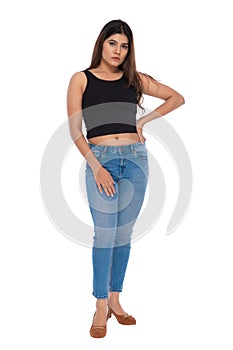 Indian you girl with camisole and jeans hot pant with elegant pose and expression