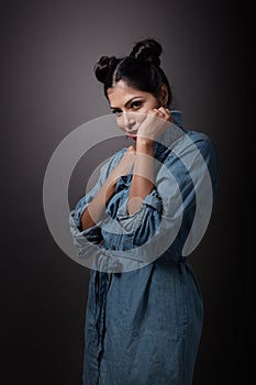 Indian young girl in blue denim one piece and stylish look