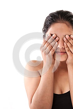 Indian Young girl closing eyes with hands