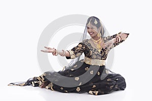 Indian young lady performing traditional dance