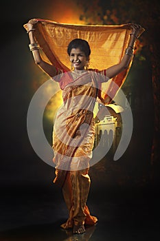 Indian young lady performing traditional dance