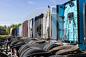 Indianapolis - Circa June 2017: Colorful Semi Tractor Trailer Trucks Lined up for Sale XII