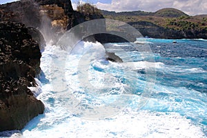 Indic sea waves hitting the cliff rocks at AngelÃ¢â¬â¢s Billabong point, an amazing spot close to Broken beach in Nusa Penida Island photo