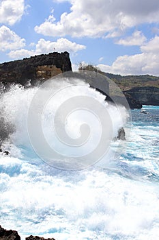 Indic sea waves hitting the cliff rocks at AngelÃ¢â¬â¢s Billabong point, an amazing spot close to Broken beach in Nusa Penida Island photo