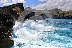 Indic sea waves hitting the cliff rocks at Angelâ€™s Billabong point, an amazing spot close to Broken beach in Nusa Penida Island