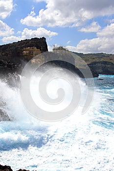 Indic sea waves hitting the cliff rocks at Angelâ€™s Billabong point, an amazing spot close to Broken beach in Nusa Penida Island