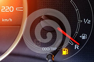 The indicator in the car on the dashboard warns of low fuel level
