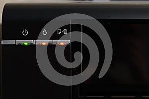 The indicators on the printer are red, the printer is broken, close-up. Multifunction printer.