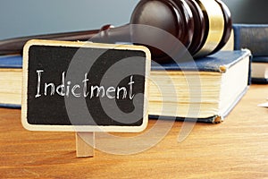 Indictment is shown on the photo using the text