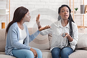 Indifferent Afro Girl Watching TV Not Listening To Her Friend