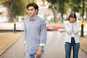 Indifferent Boyfriend Leaving Crying Girlfriend Quitting Relationship Outdoors