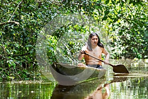 Indigenous Adult Man In Wooden Canoe