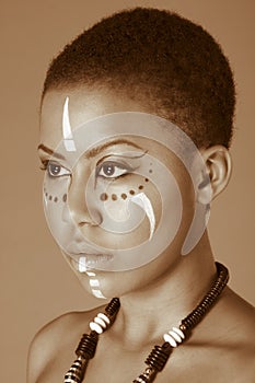 Indigenous Afro American woman in tribal facepaint