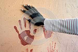 Indigenous Australian woman hand print on a wall