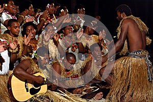 Indigenous Fijian people sing and dance in Fiji