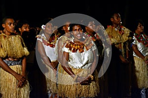 Indigenous Fijian people sing and dance in Fiji