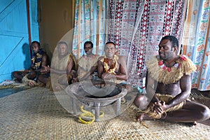 Indigenous Fijians men participate in traditional Kava Ceremony