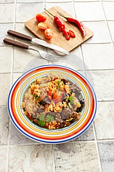 Indigenous Ghanaian, African-Caribian food Jollof Rice with tomato sauce, regional spices, chicken meat and offal