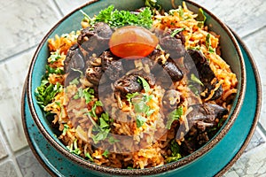 Indigenous Ghanaian, African-Caribian food Jollof Rice with tomato sause, regional spices, chicken meat and offal photo