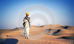 Indigenous Indian Man Playing Wind Pipe Desert Concept