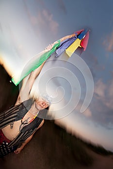 Indigenous man with ceremonial pole