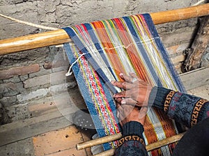 Indigenous Quechua Man Weaving Handspun Wool