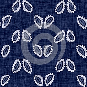 Indigo blue batik dyed flower texture background. Seamless japanese repeat pattern swatch. Block print leafmotif bleach