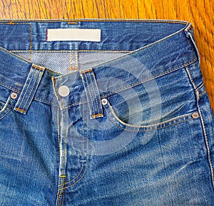 Indigo jeans with a button