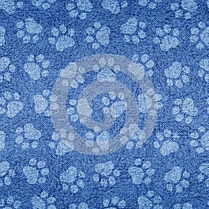 Indigo paw print. Pets seamless pattern. Paw texture. Cute blue background for dog or cat. Modern stylish denim fabric. Irregular