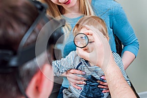 Indirect ophthalmoscope. Retinal examination. Fundoscopy. Child vision test.