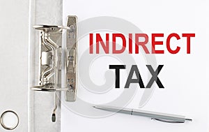 INDIRECT TAX text on the paper folder with pen. Business concept