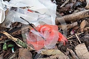 Indiscriminate litter of plastic non-biodegradable at garbage dump