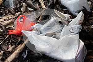 Indiscriminate litter of plastic non-biodegradable at garbage dump