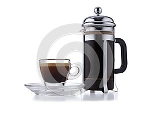 Individual cafetiere, and glass expresso cup and saucer full of smooth expresso coffee, isolated on white