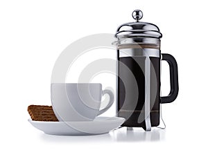 Individual cafetiere, and white expresso cup and saucer full of smooth expresso coffee, isolated on white with a slight drop