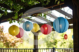 individual hanging paper lanterns from the terrace pergola