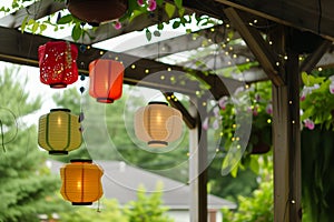 individual hanging paper lanterns from the terrace pergola