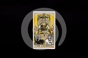 An individual major arcana tarot card isolated on black background. The Chariot.