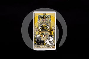 An individual major arcana tarot card isolated on black background. The Chariot. photo