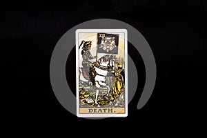 An individual major arcana tarot card isolated on black background. Death. photo