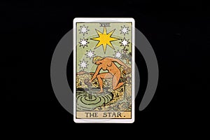 An individual major arcana tarot card isolated on black background. The Star.