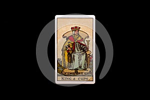 An individual minor arcana tarot card isolated on black background. King of cups.