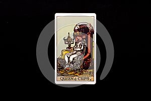 An individual minor arcana tarot card isolated on black background. Queen of cups.