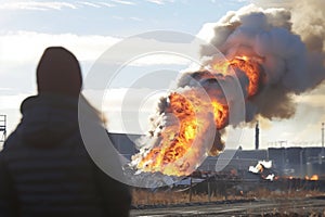 individual observing a largescale waste combustion at a facility