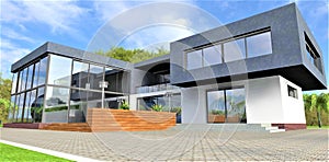 Individual project of a country family house with glass facade elements. Dedicated patio area near the entrance and paved area of