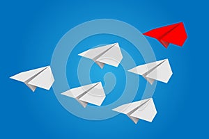 Individual red leader paper plane lead other on blank copy space background. Business and leadership concept