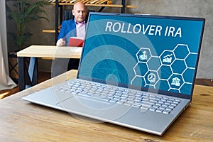 Individual Retirement Accounts ROLLOVER IRA inscription on the laptop