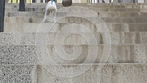 Individual symbolically reaches top of stairs after working hard, accomplishment