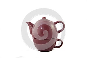 Maroon ceramic teapot on white background photo