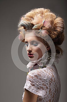 Individuality. Haute Couture. Swanky Woman with Colored Hair photo